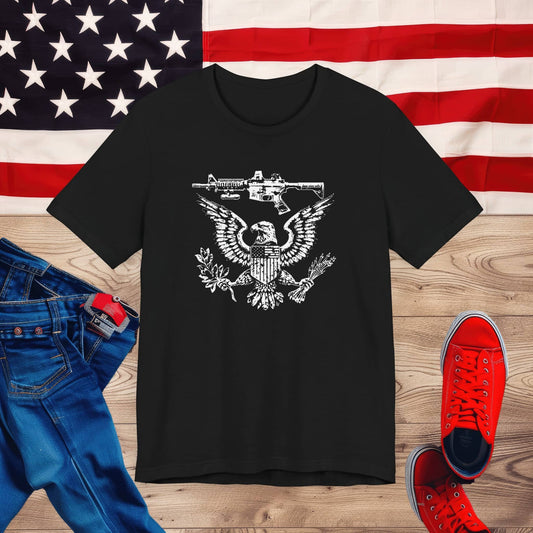 Patriotic Eagle and Rifle T-Shirt, American Flag Inspired Military Graphic Tee, Bold Eagle & Rifle Design, Proud USA Themed Apparel Unisex Jersey Short Sleeve Tee