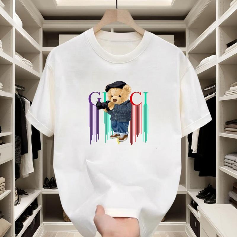 Black or white, this trendy T - shirt with a camera - bear, checkered style and colorful drips, made of comfy cotton, suits any occasion
