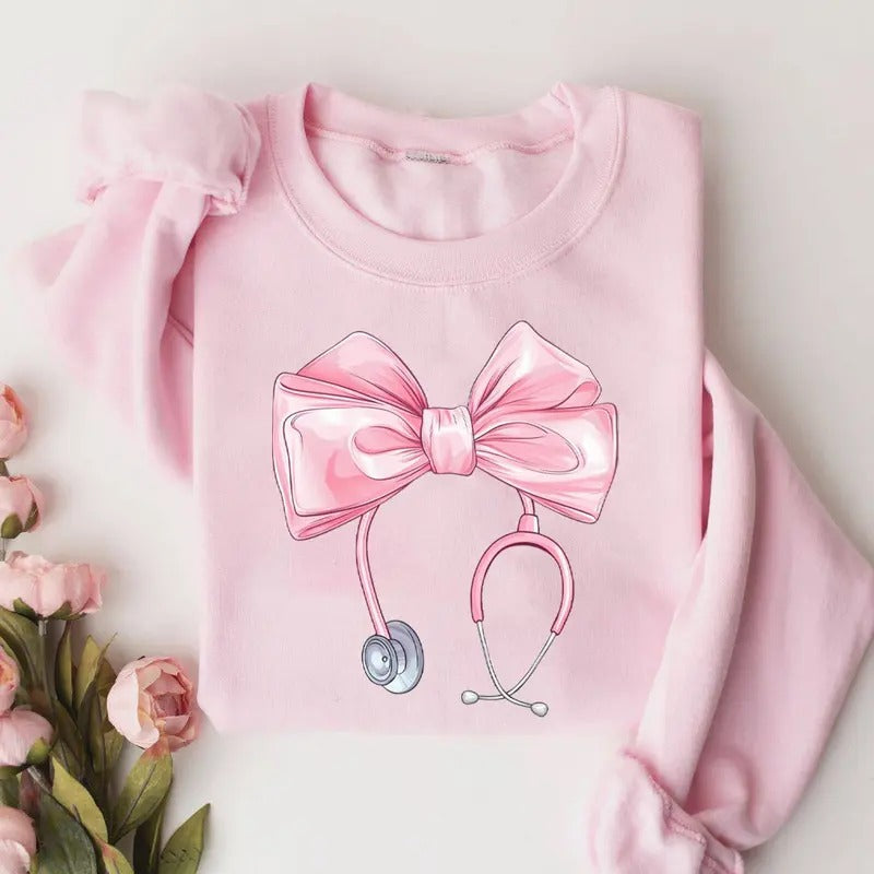 Coquette Nurse Stethoscope Bow Sweatshirt, Cute Pink Bow Nurse Sweatshirt, Nurse Shirt, Gift for Nurse, ER RN Nurse Appreciation Shirt, Nurse Bow Shirt, Coquette Nurse Shirt, Nurse Ribbon Shirt